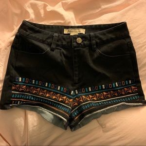 Faded black short shorts with colorful accents